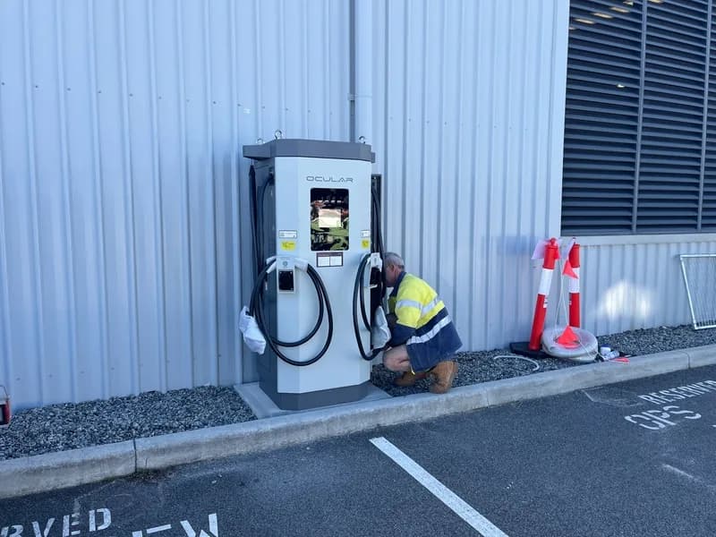 ChargingWA technician installing an Ocular DC charger outside a Perth business