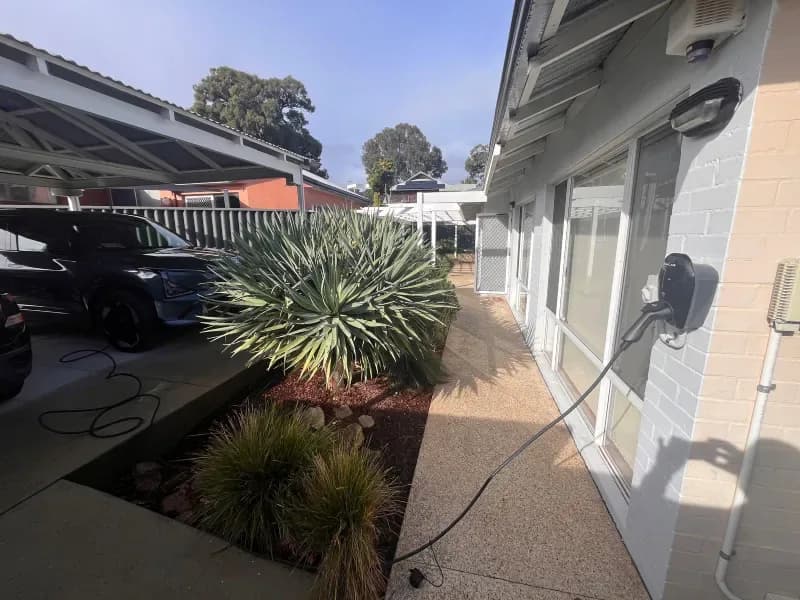 Home EV charger mounted on a detached carport post in Wembley Downs, Perth