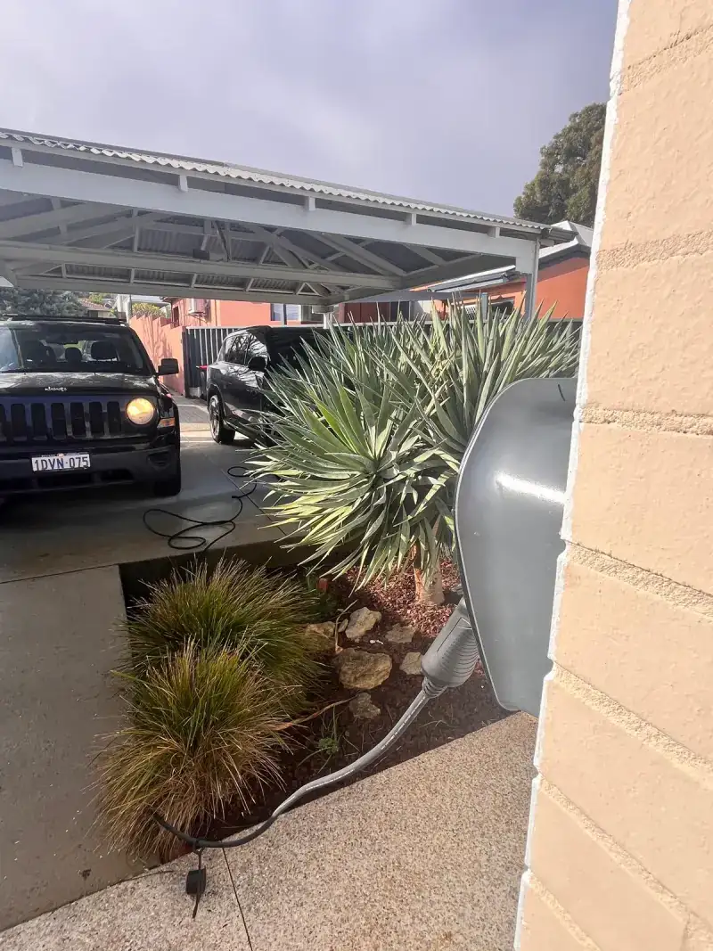 Ocular IQ Home Solar EV charger installed on the wall of a Wembley Downs home in Perth