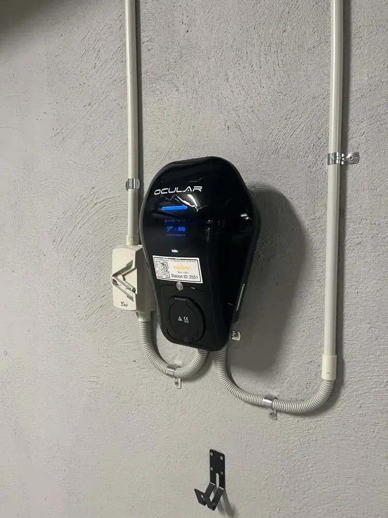 Ocular IQ Wallbox EV charger with RFID access and an Exploren label in a Dalkeith apartment car park