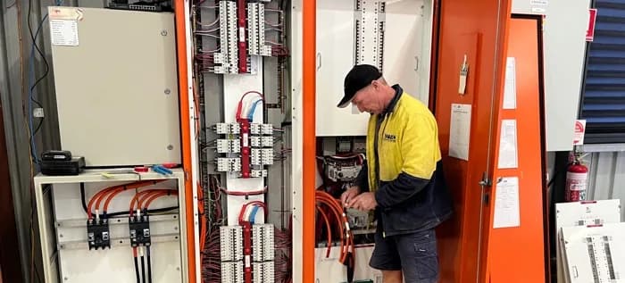 ChargingWA electrician checking a switchboard before an EV charger installation in Perth